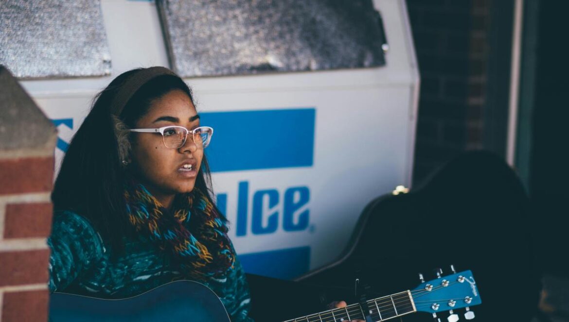 woman playing guitar
