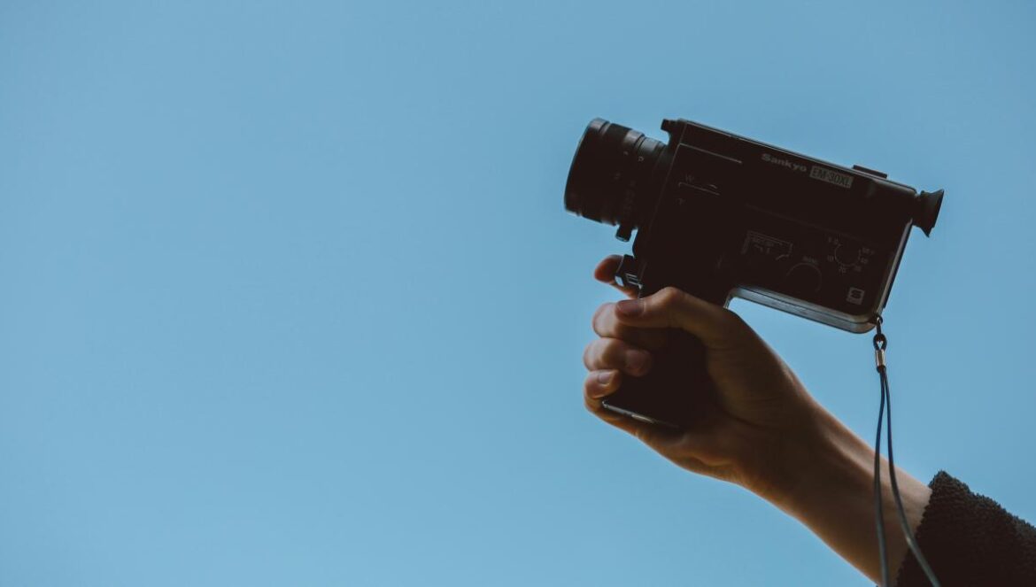 person holding video camera