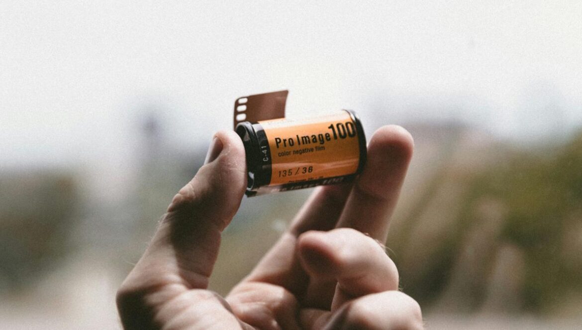 person holding Pro Image 100 tape