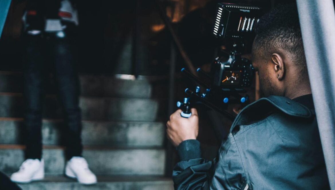 man taking photo of another man