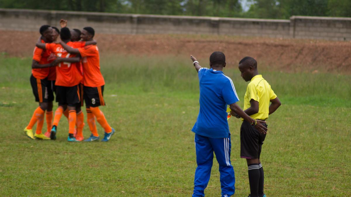 coach of the other team complaining at the referee