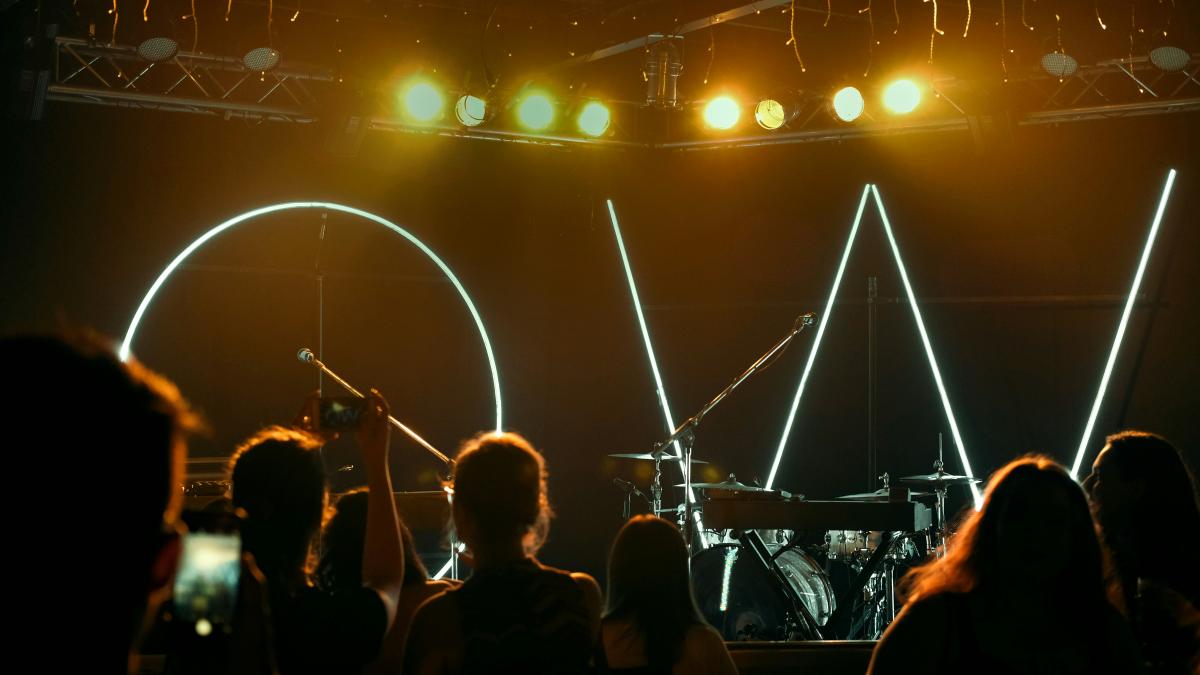 people watching concert on stage