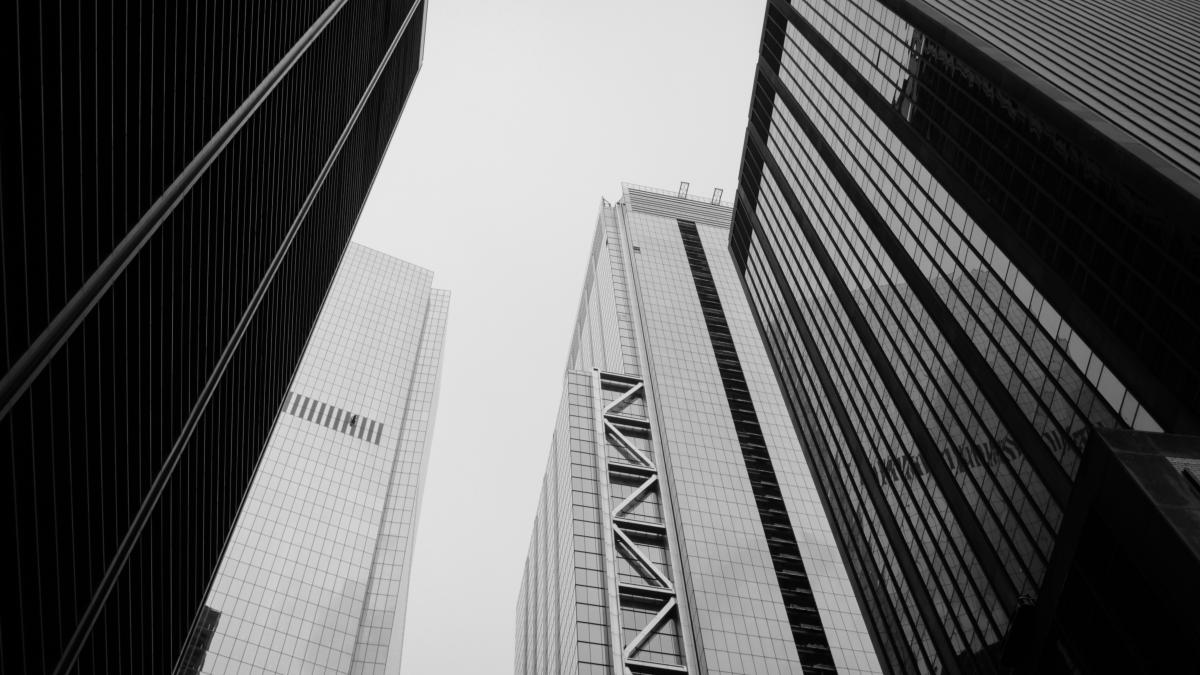 grayscale photography of curtain wall buildings