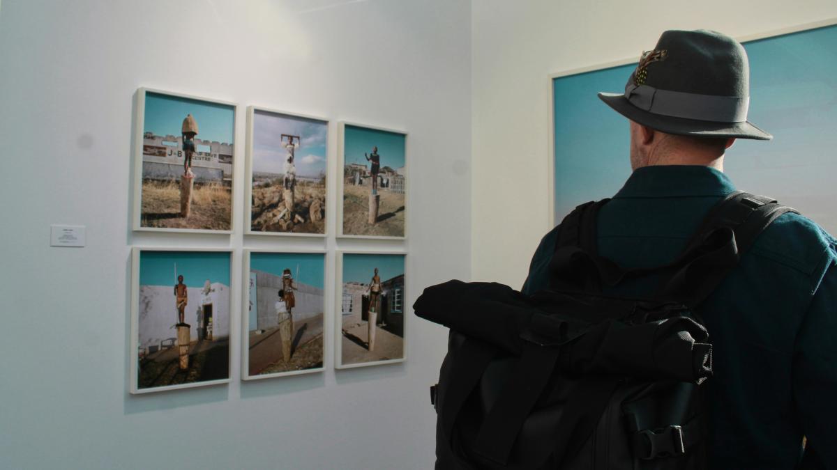 person wearing black fedora hat