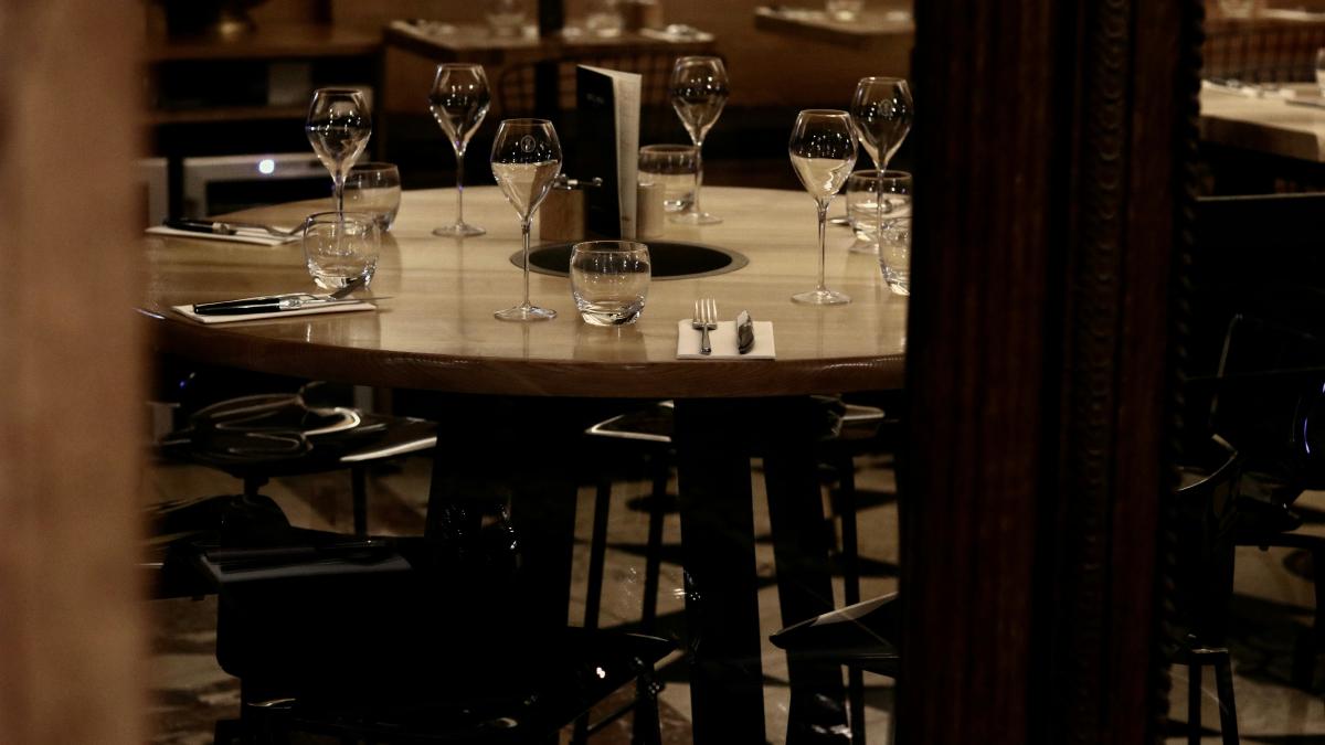 clear drinking glasses on brown wooden table