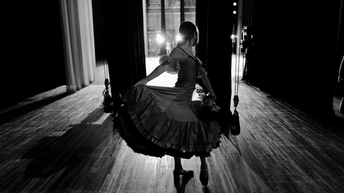 woman in white dress playing violin