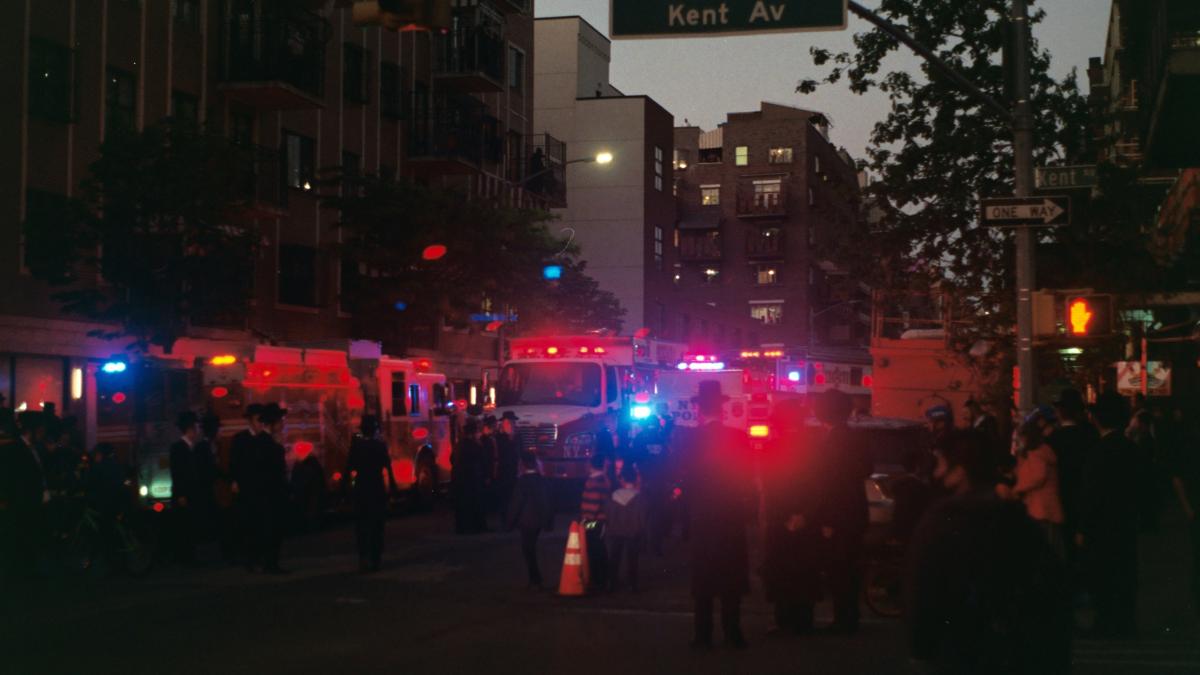 people walking on street during night time