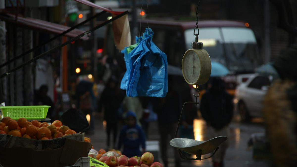 fruit stand on the street during night time