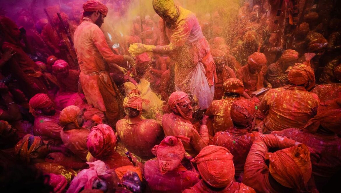 people in red and yellow dress dancing