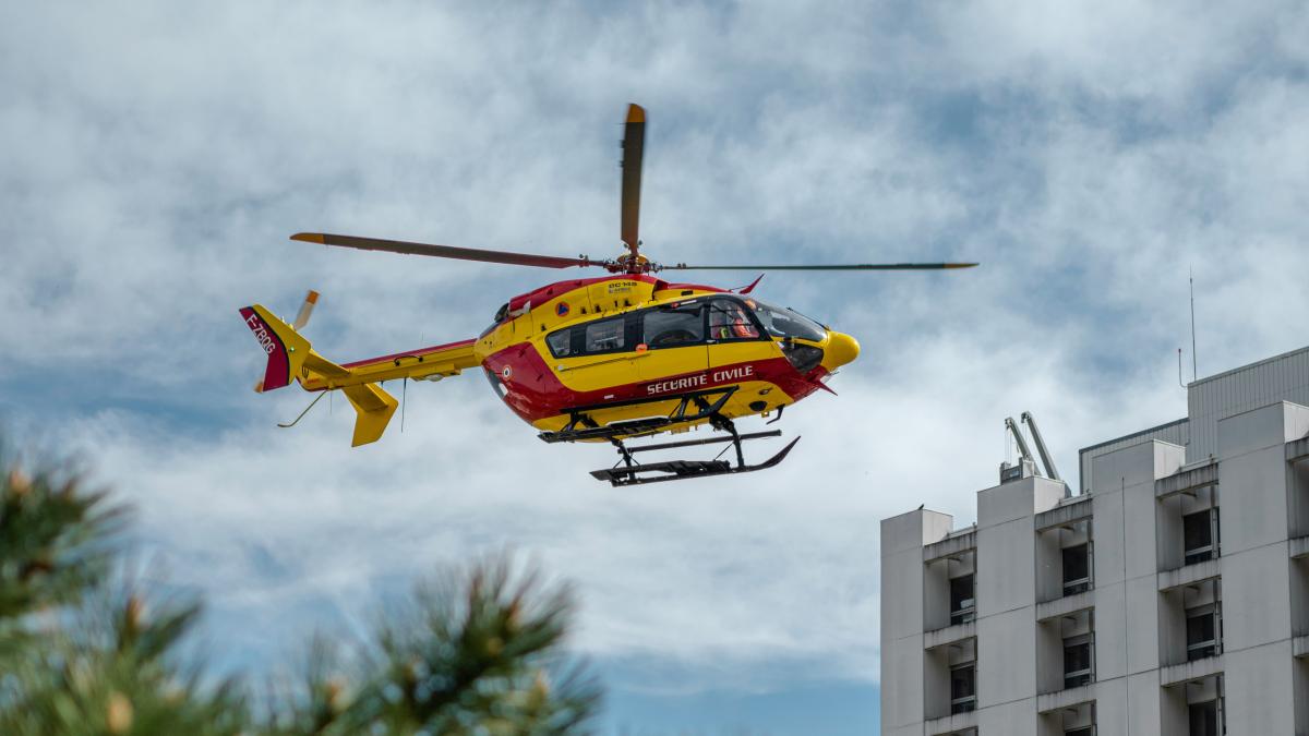 yellow and orange helicopter flying in the sky