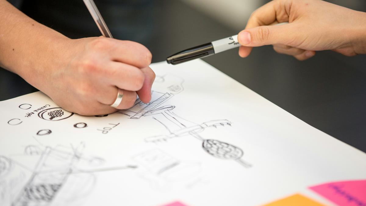 person writing on white paper