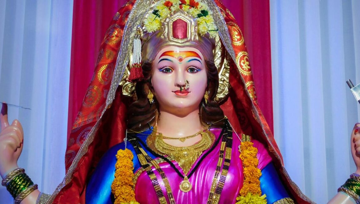 woman in red and gold sari