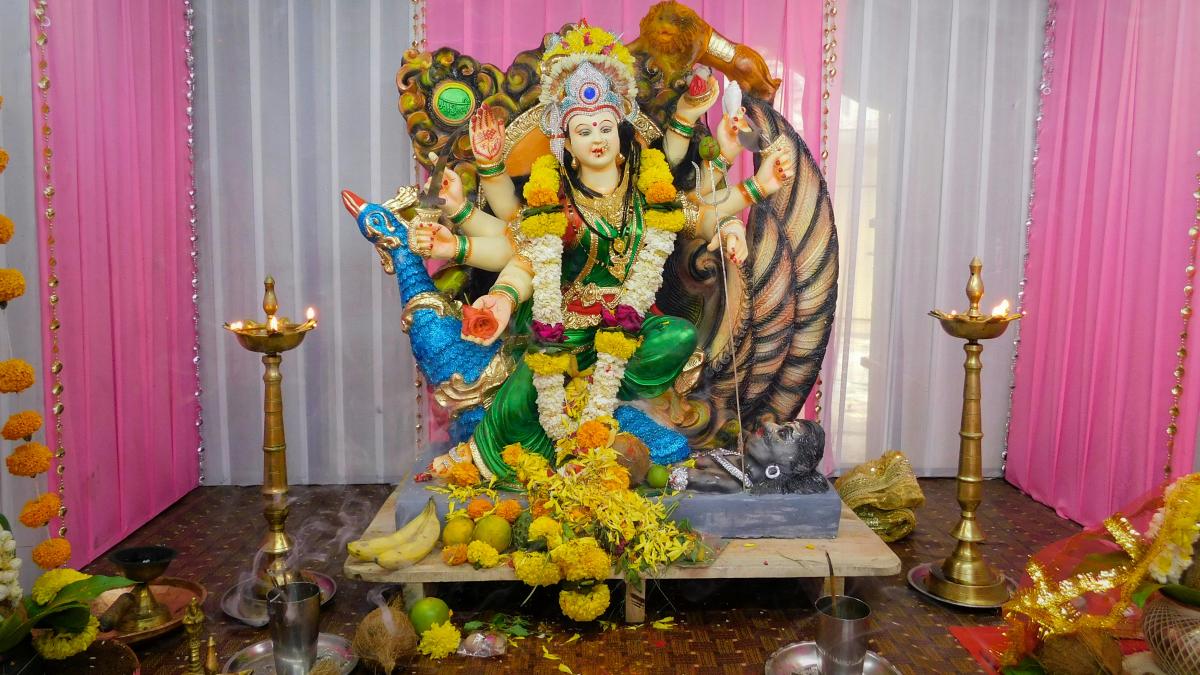 hindu deity figurine on table