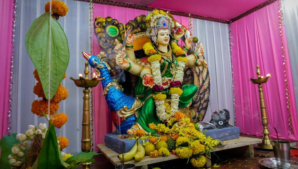 a statue of a woman sitting on top of a table