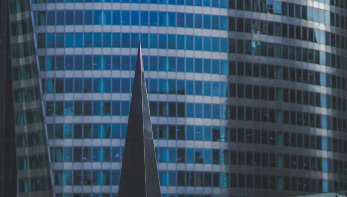 a very tall building with a clock on it's side