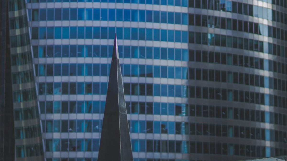 a very tall building with a clock on it's side