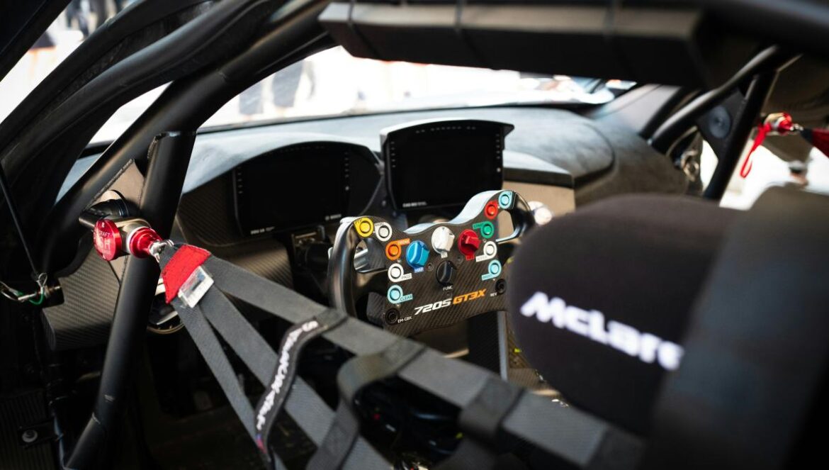 a close up of a car dashboard with a steering wheel