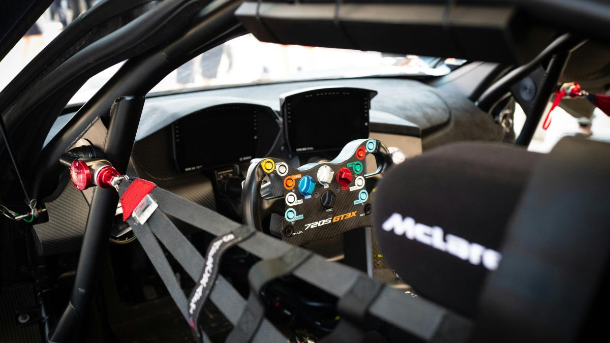 a close up of a car dashboard with a steering wheel