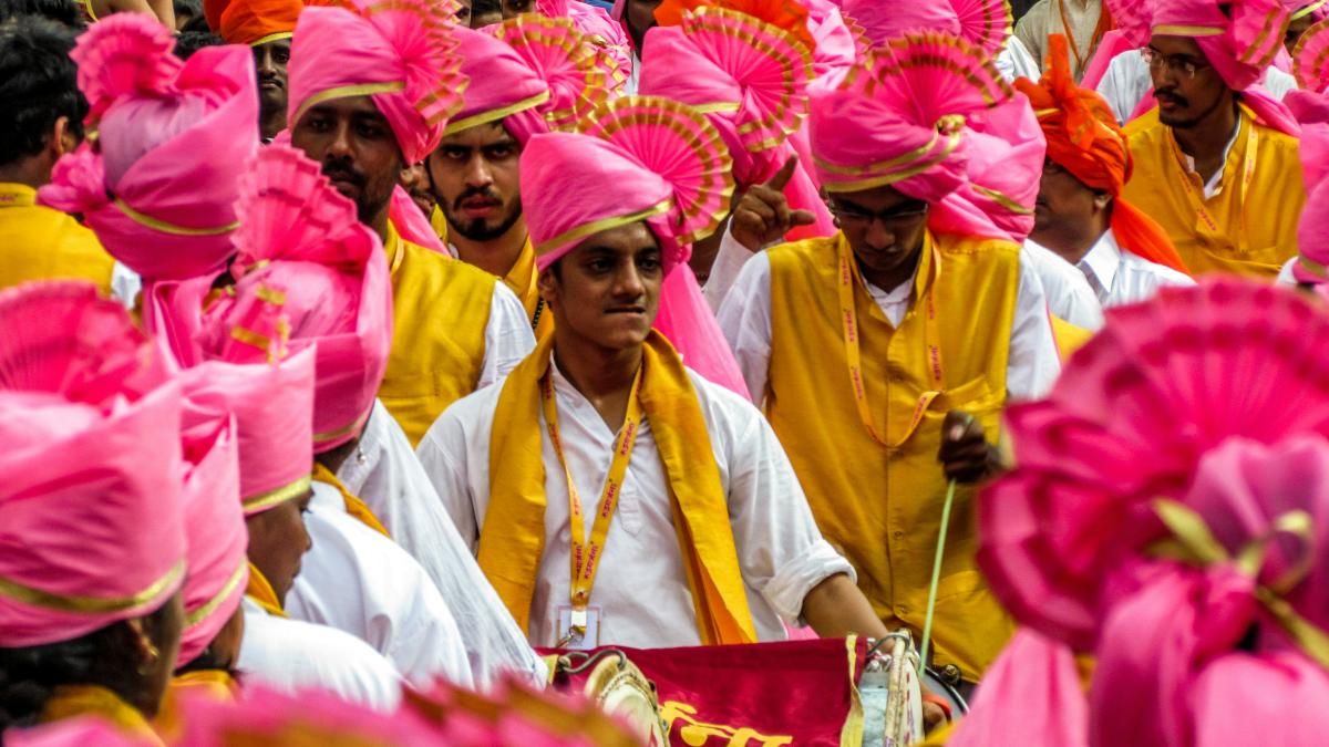 a group of people wearing colorful hats