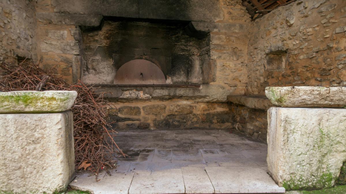 a stone building with a stone wall