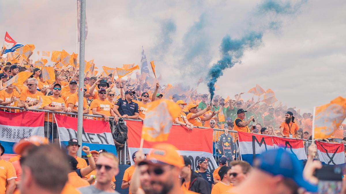 a crowd of people holding flags