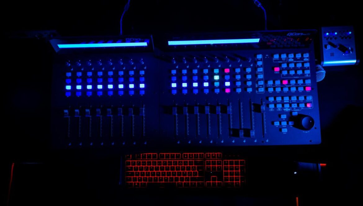 a computer with a lot of buttons on it in the dark