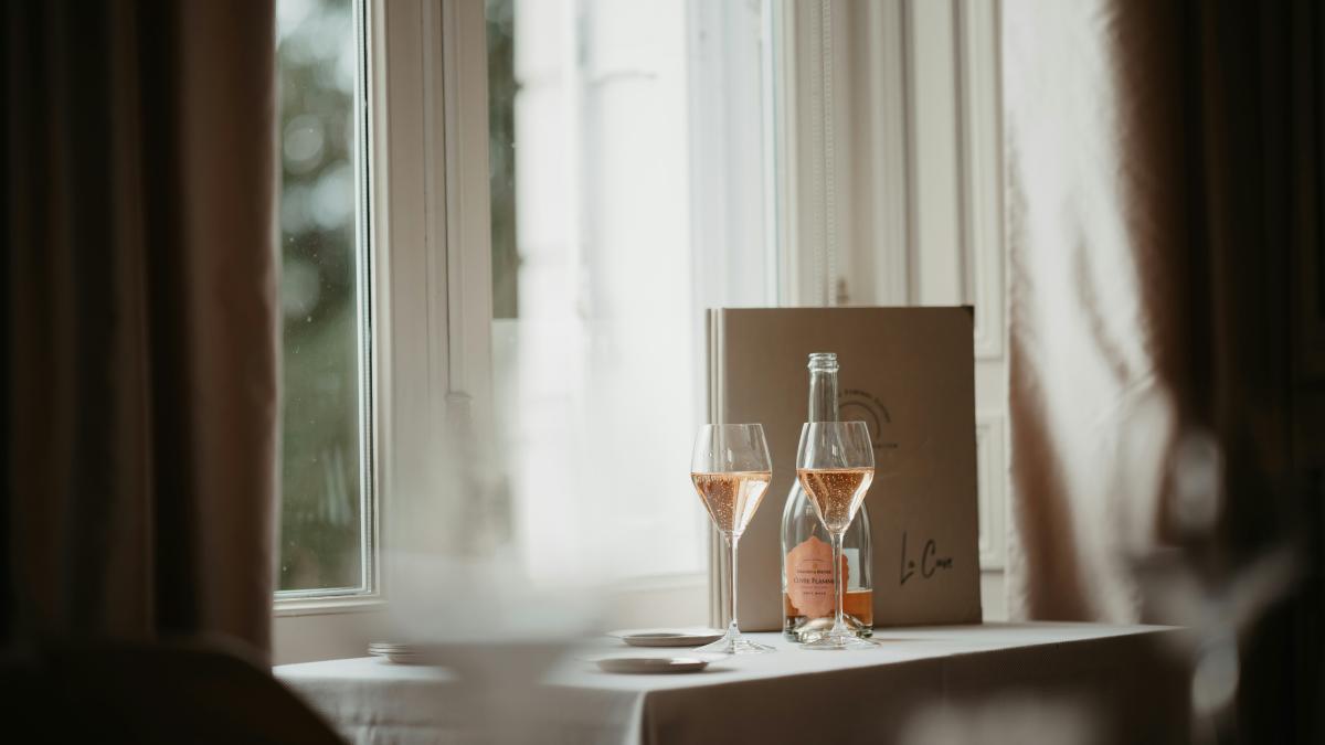 a couple of wine glasses sitting on top of a table
