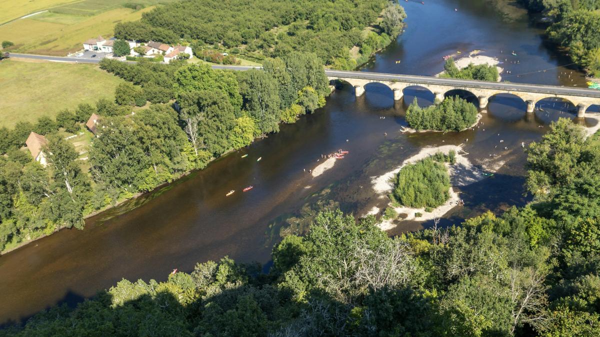 an aerial view of a bridge over a river