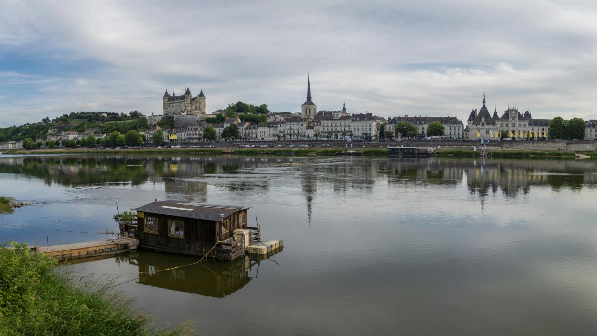 a small boat floating on top of a lake
