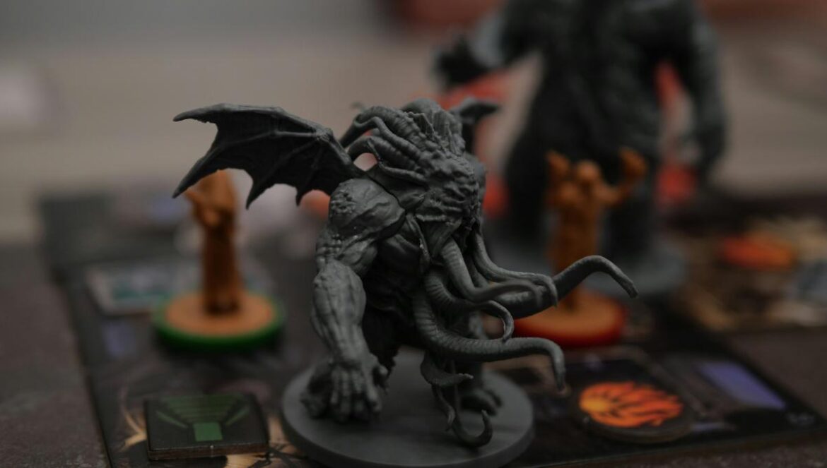 a close up of a dragon figurine on a board game