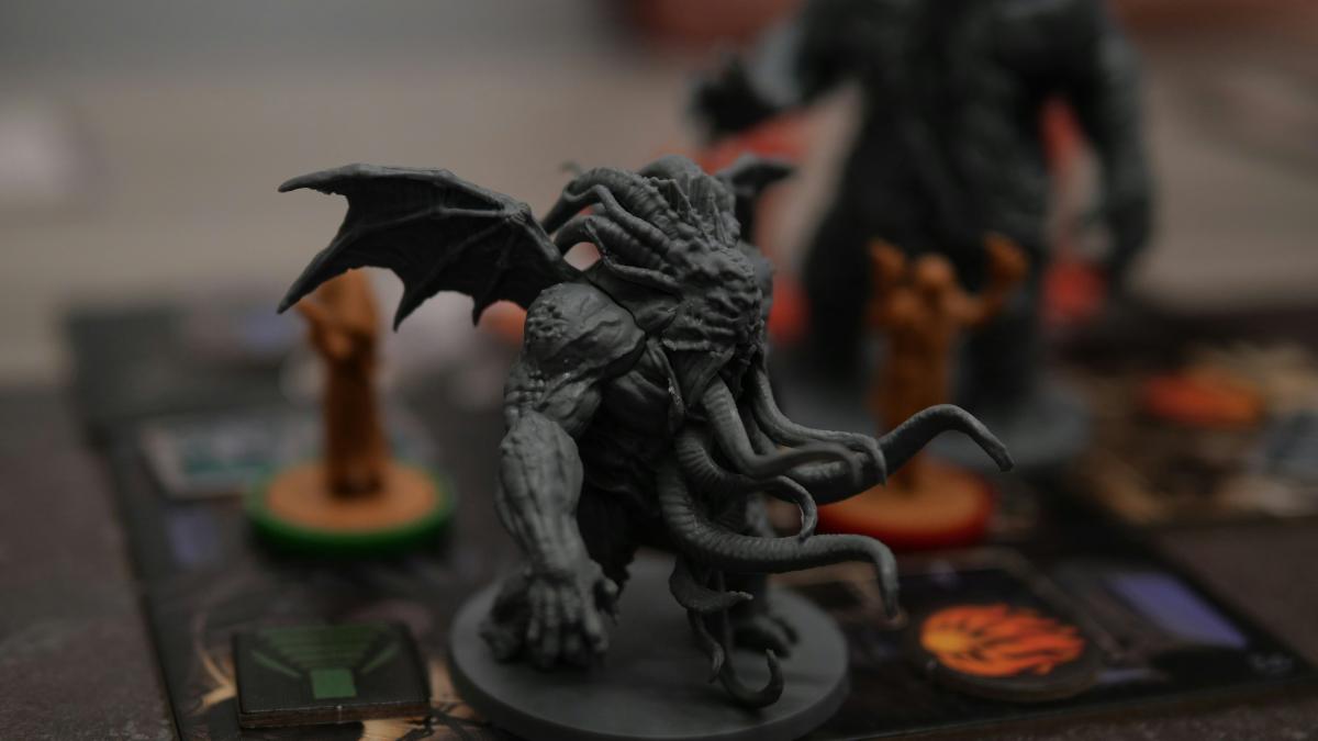 a close up of a dragon figurine on a board game