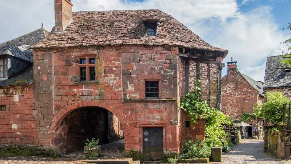 an old brick building with a stone walkway leading to it