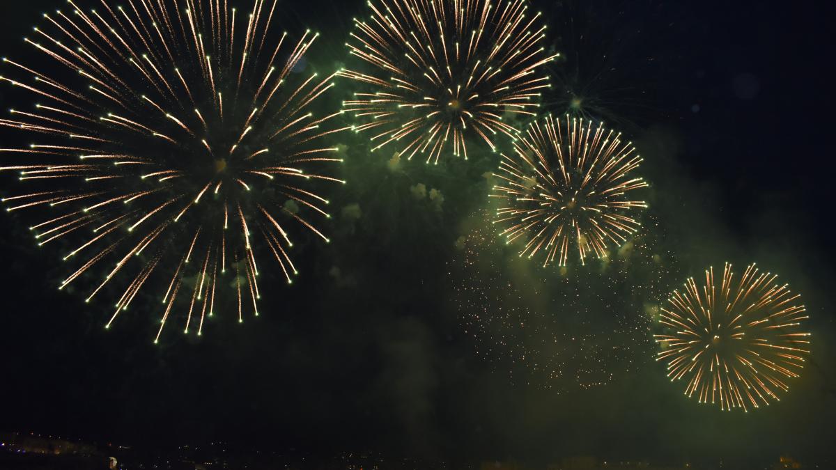 a bunch of fireworks are lit up in the night sky