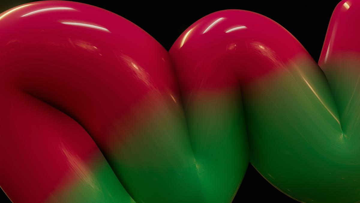 a red and green object with a black background