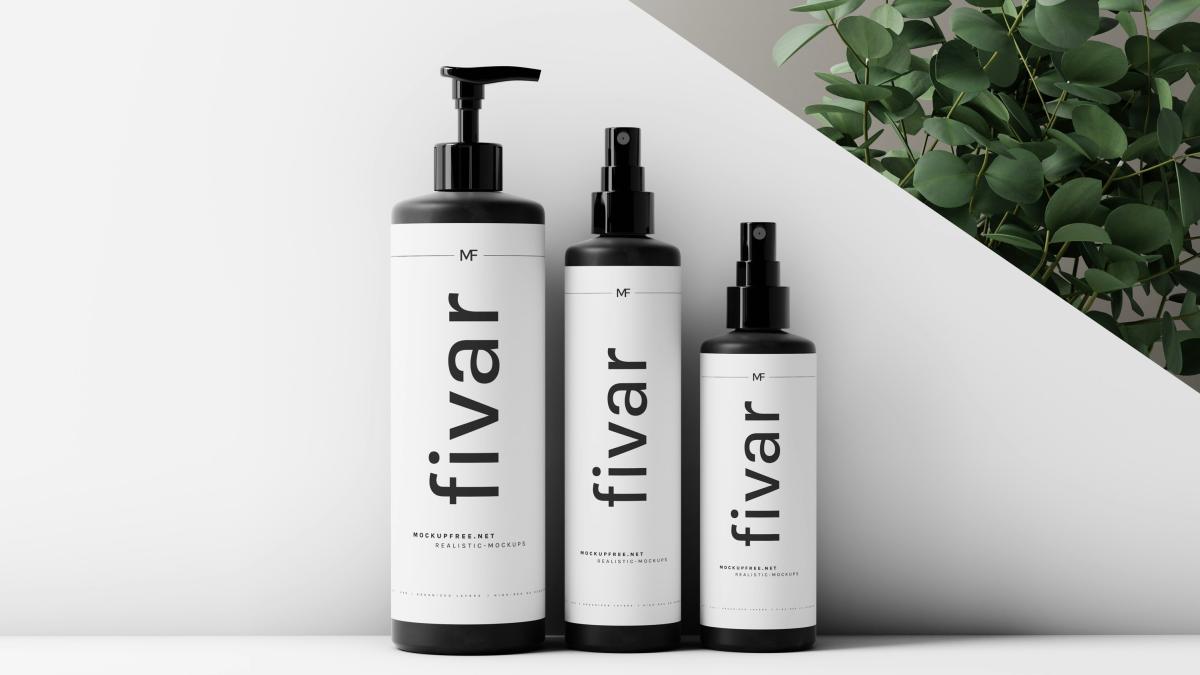 a couple of bottles that are next to a plant