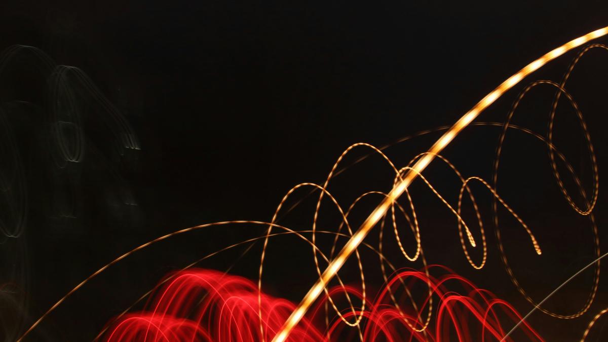 a blurry photo of lights in the dark