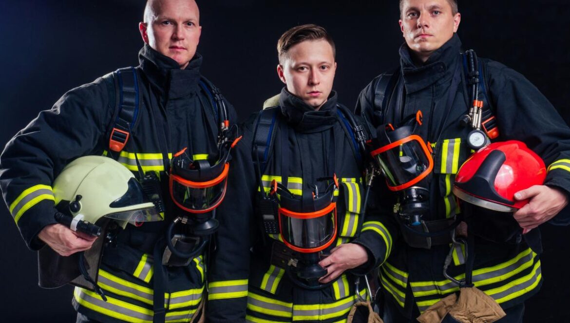 a group of firefighters standing next to each other