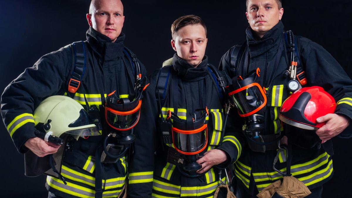 a group of firefighters standing next to each other