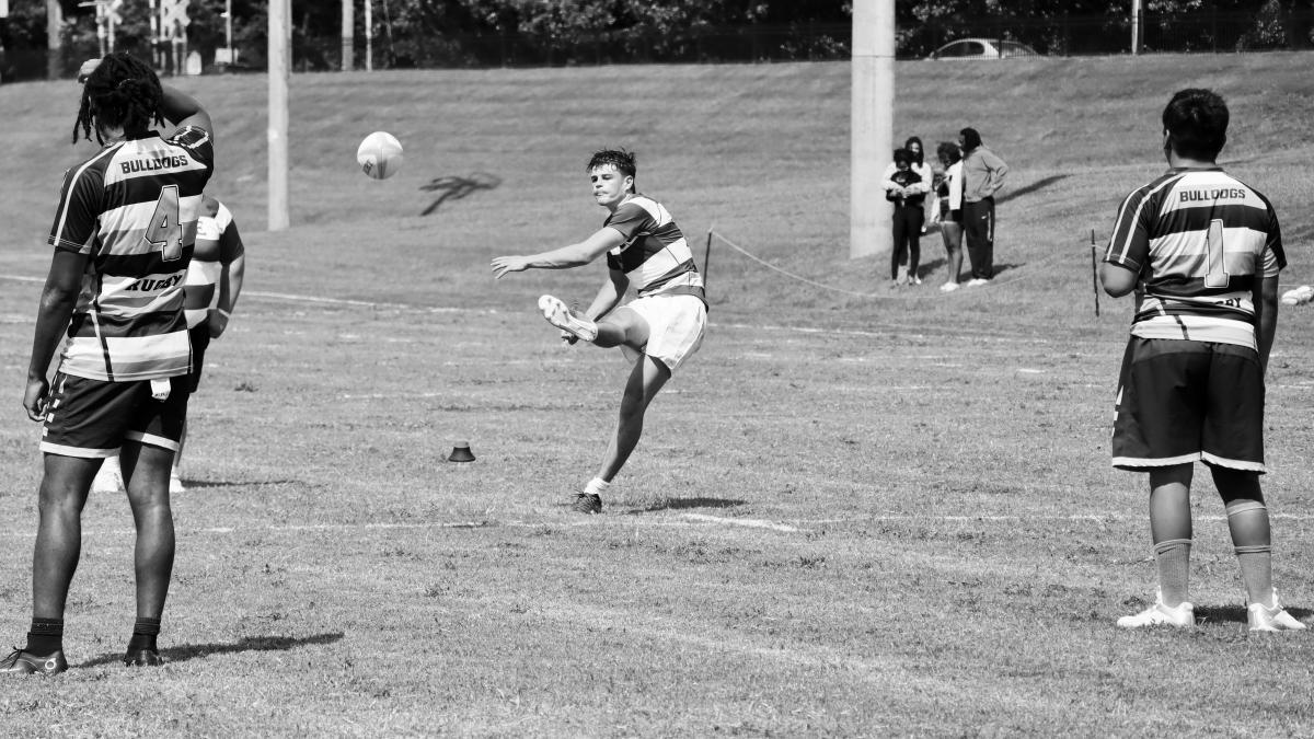 A group of young men playing a game of soccer