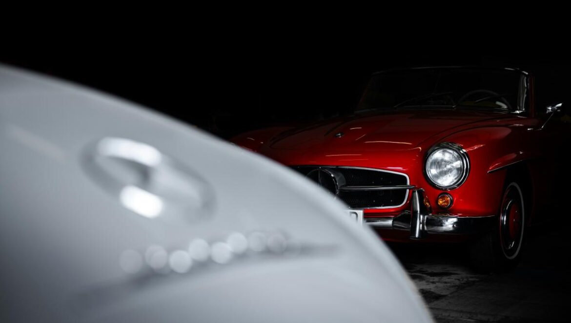 A red car parked in a dark garage