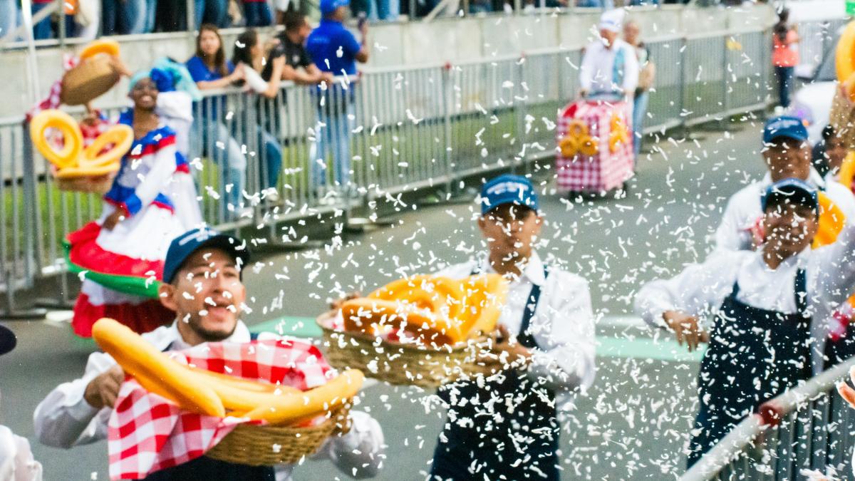 A group of people that are standing in the street