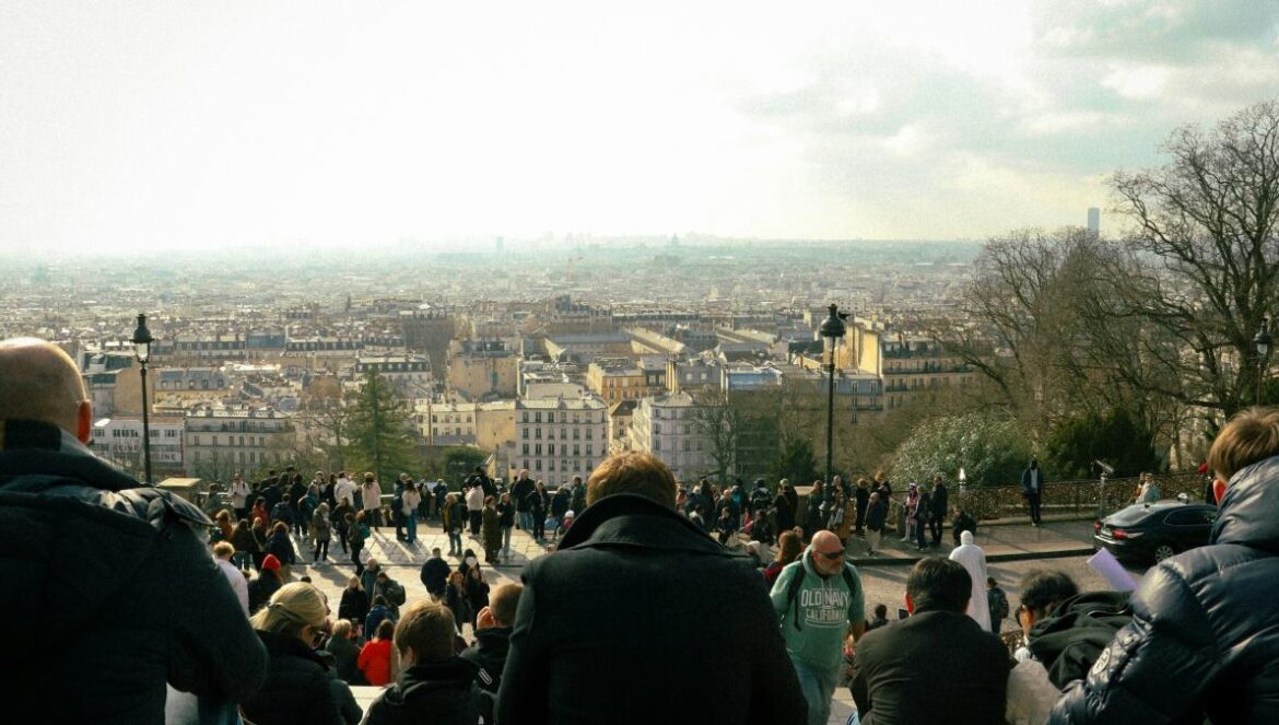 A group of people standing on top of a hill