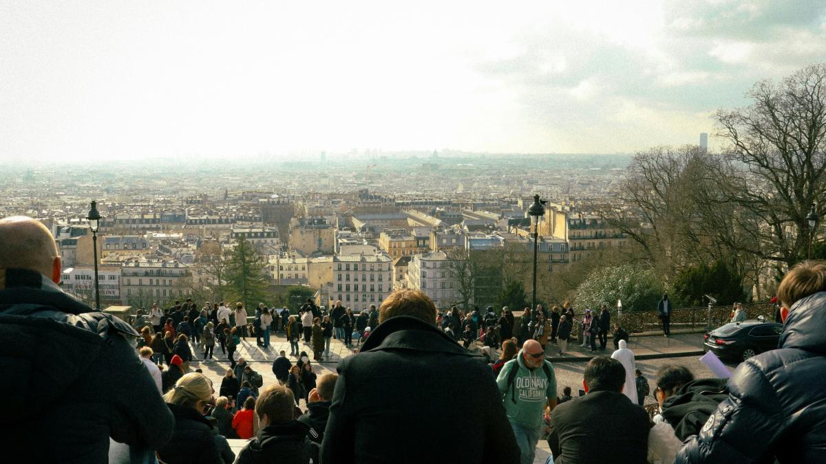 A group of people standing on top of a hill