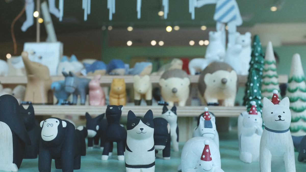 white and black cow ceramic figurines