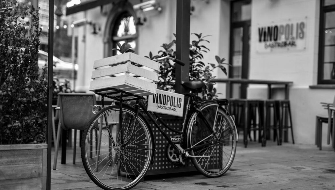 grayscale photo of a city bicycle