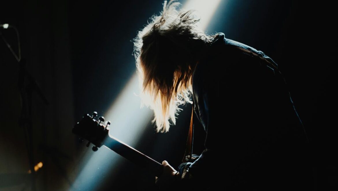 man playing guitar