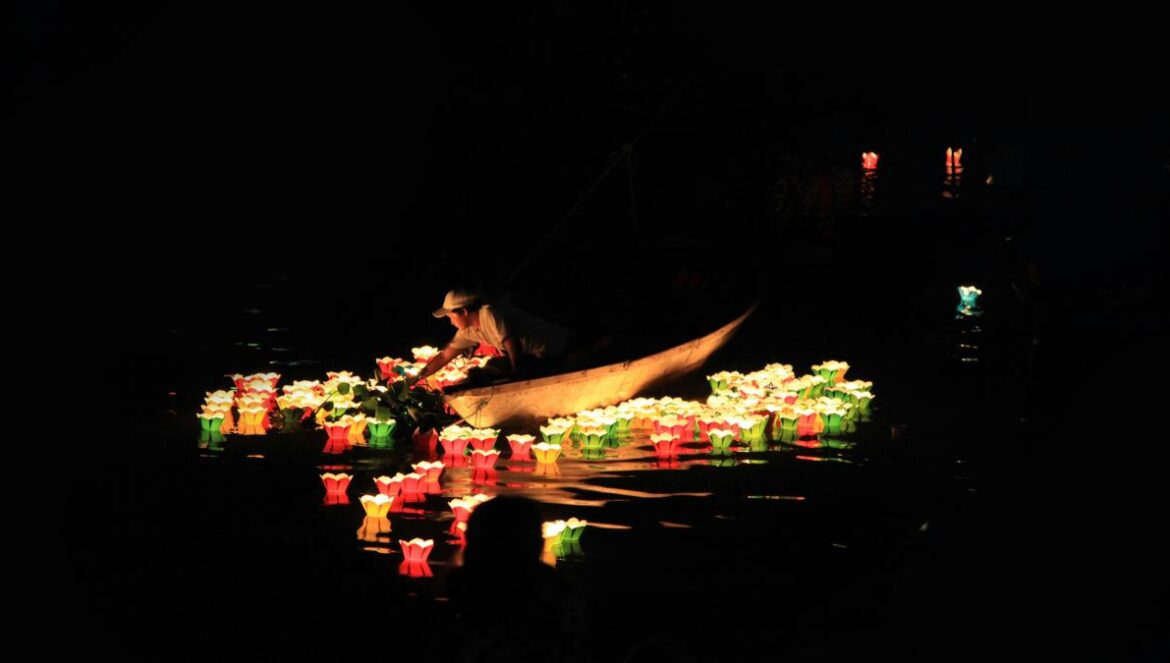 man riding on boat with lights