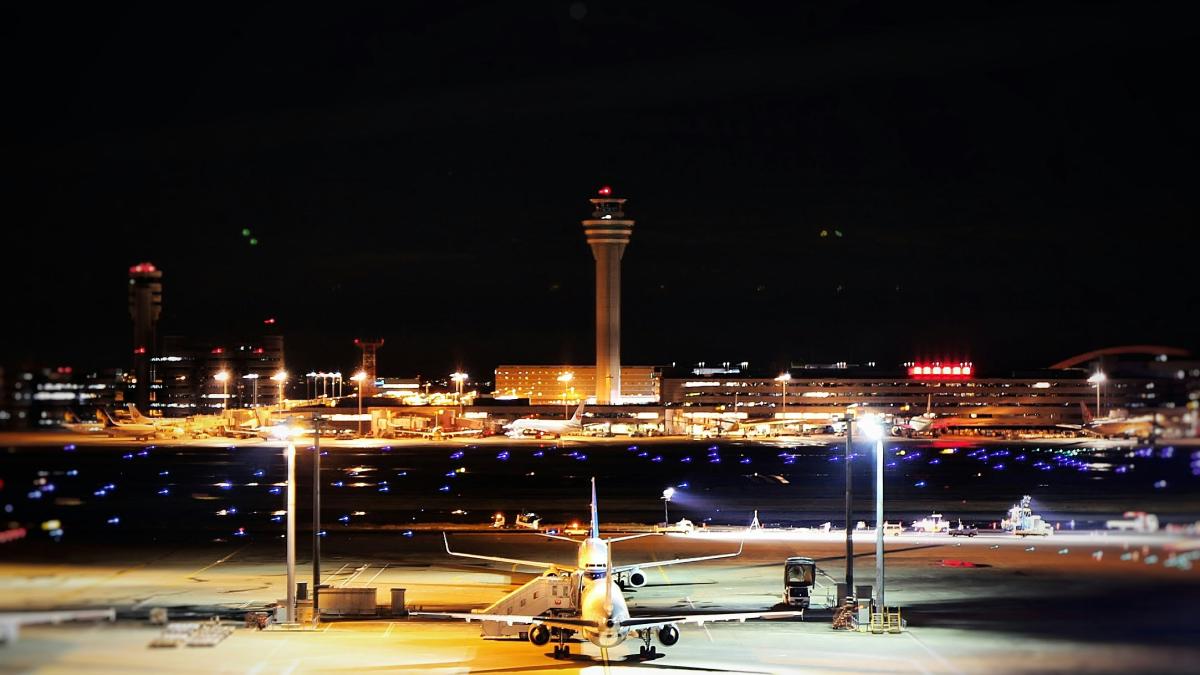 a large jetliner sitting on top of an airport tarmac
