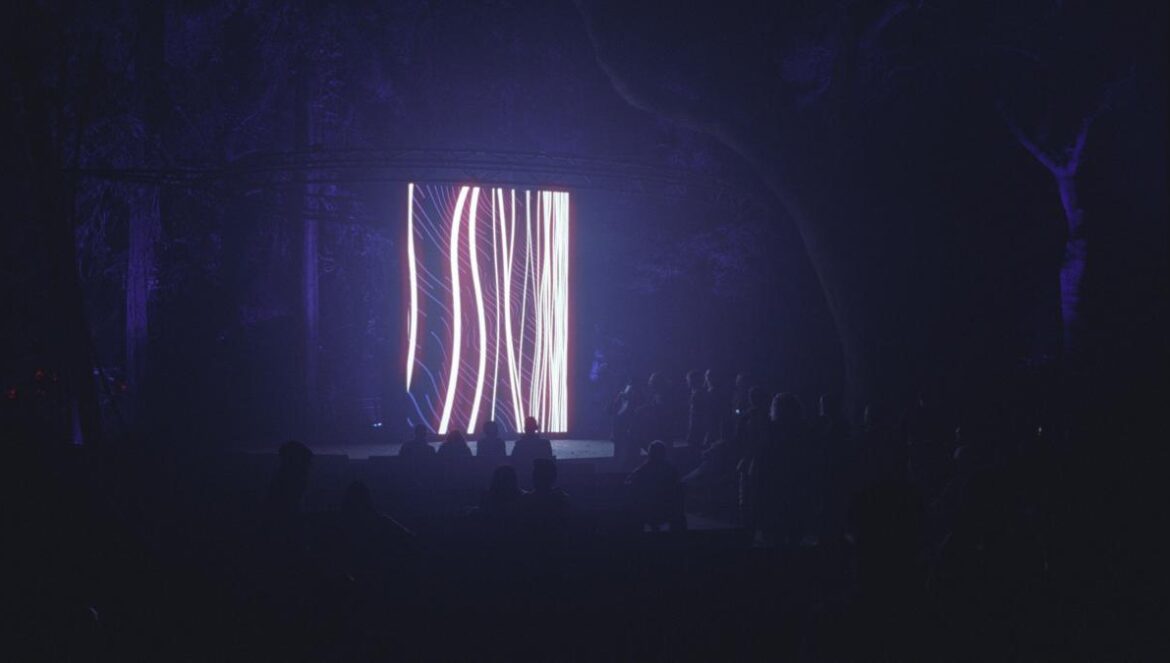 photo of people standing near stage