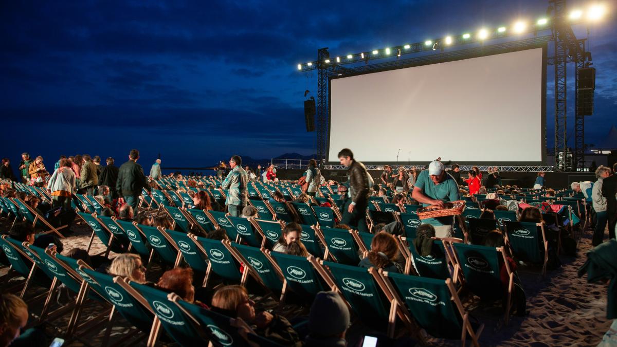 group of people sitting on raw gray chairs